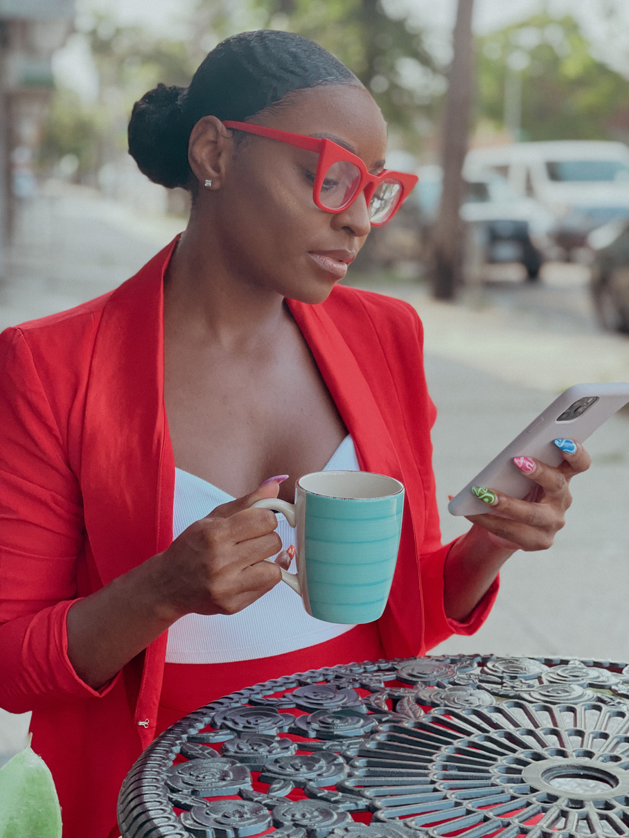 Office Girl using Phone while Holding a Mug 