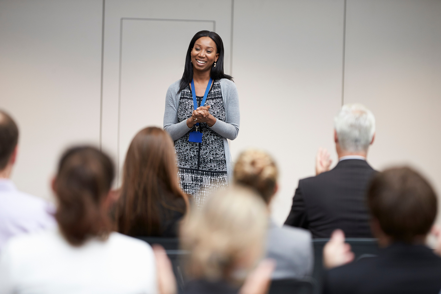 Audience Applauding Speaker after Conference Presentation