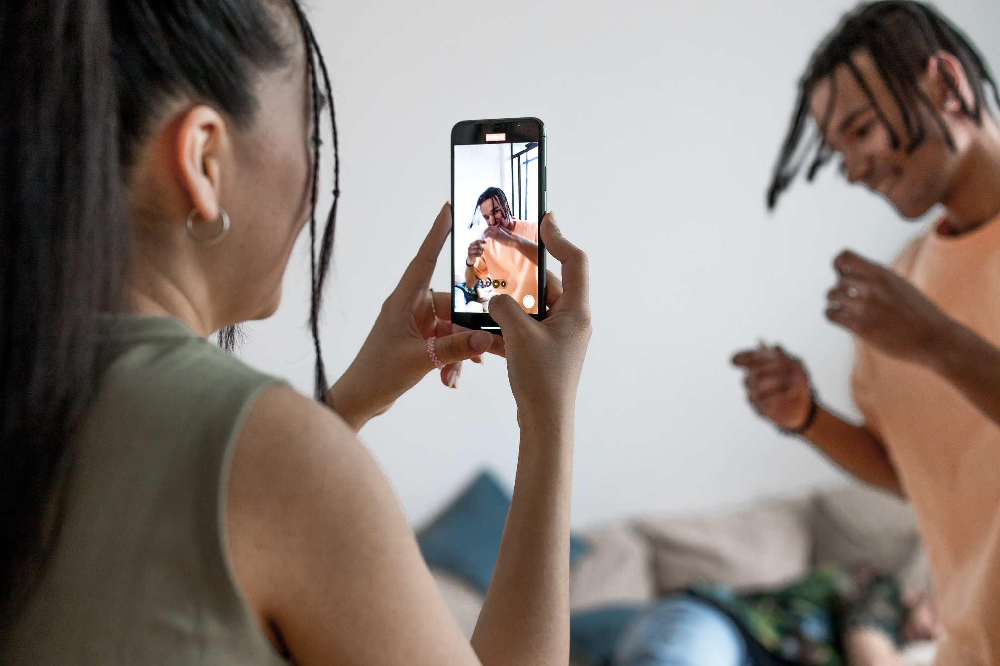 A Woman Taking Video of Her Friend